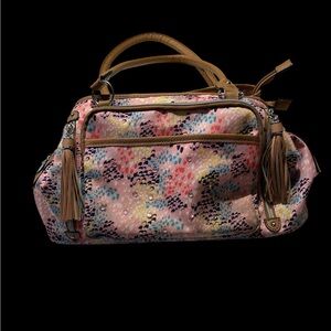 A very pretty pink and blue purse with bling and tassels